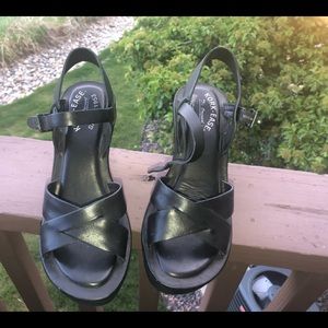 Kork-eas black wedge sandals .